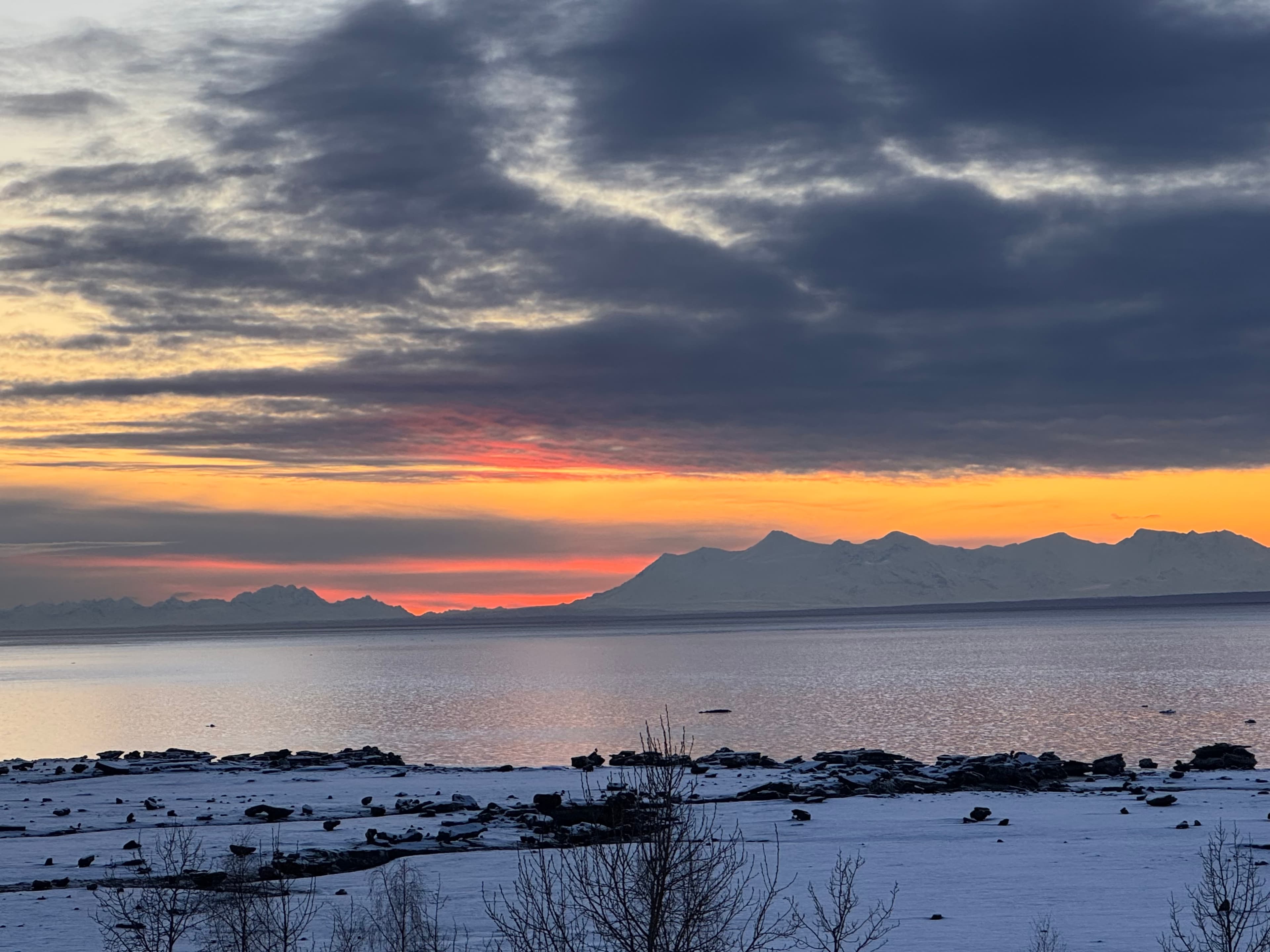 Dramatic clouds and sunset over Mt. Spurr from Bootleggers Landing